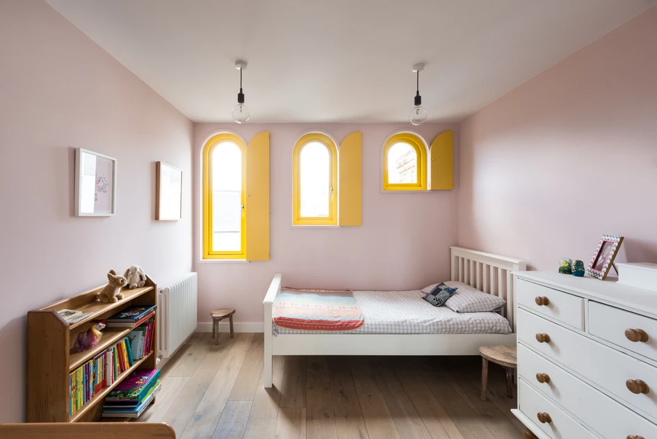 Wall-defining bright yellow window frames at the Valetta House by Office S&M. Photo: French + Tye