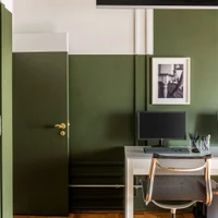 Bold cuts of contrasting paint colours graphically define the walls at the Pauliceia Apartment by Ricardo Abreu Arquitetos. Photos: Renato Navarro