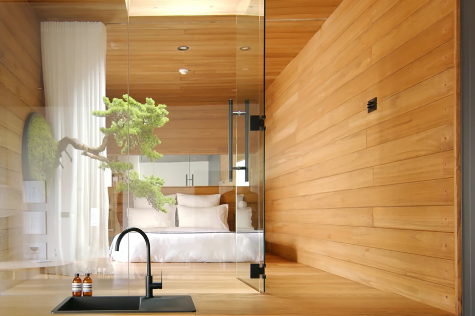 A Unique zero-maintenance wall-fixed bonsai tree provides biophilic mediation to an interior zen garden at The Ryokan Manly House by Dform project. Photo: Never Too Small | Nam Tran