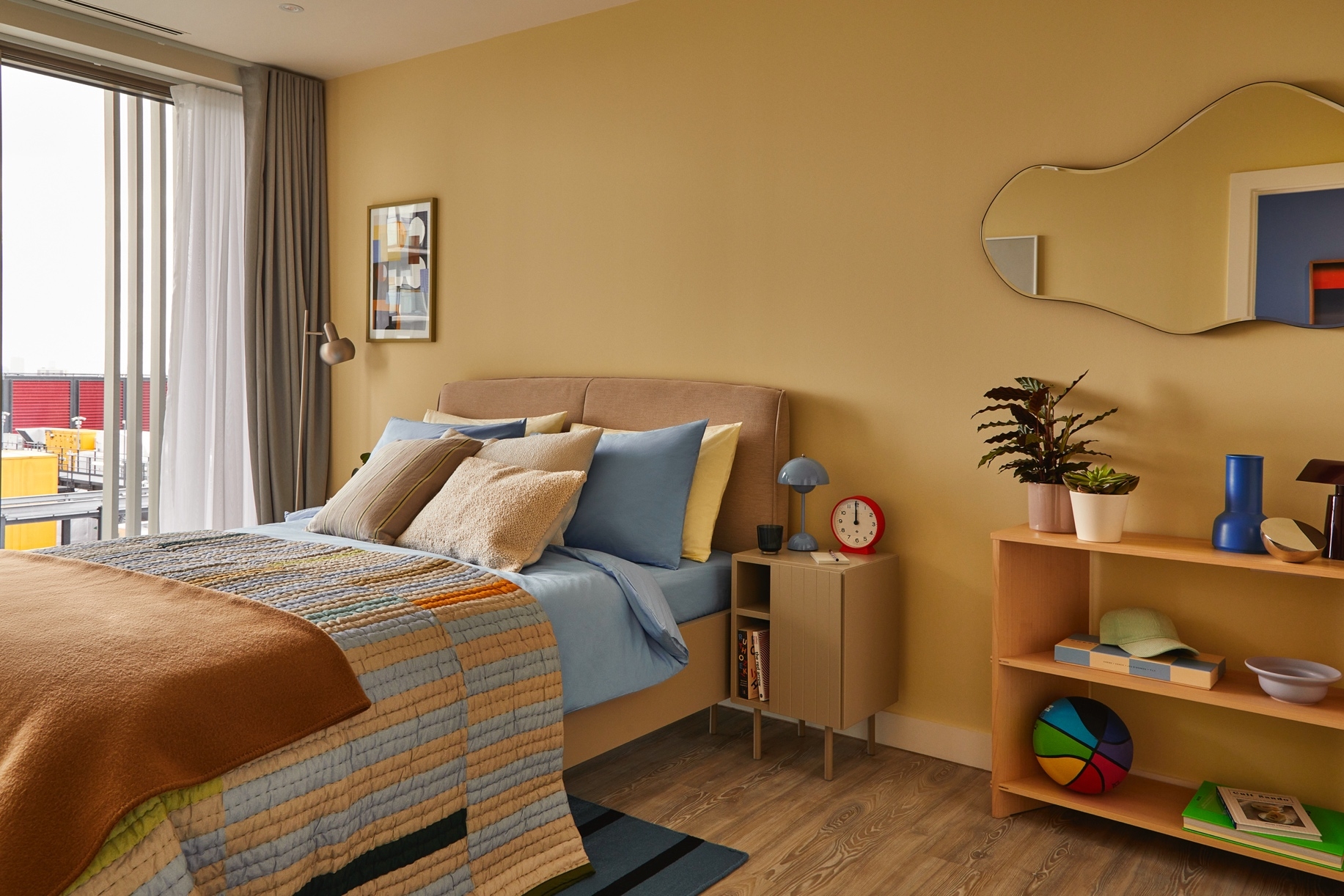 Amy Heffernan of Studio Heff demonstrates how to create refreshing colour combinations in the bedroom. A light brown Houston bed and Lugano nightstand from BoConcept are matched with baby blue, pastel yellow and camel brown 