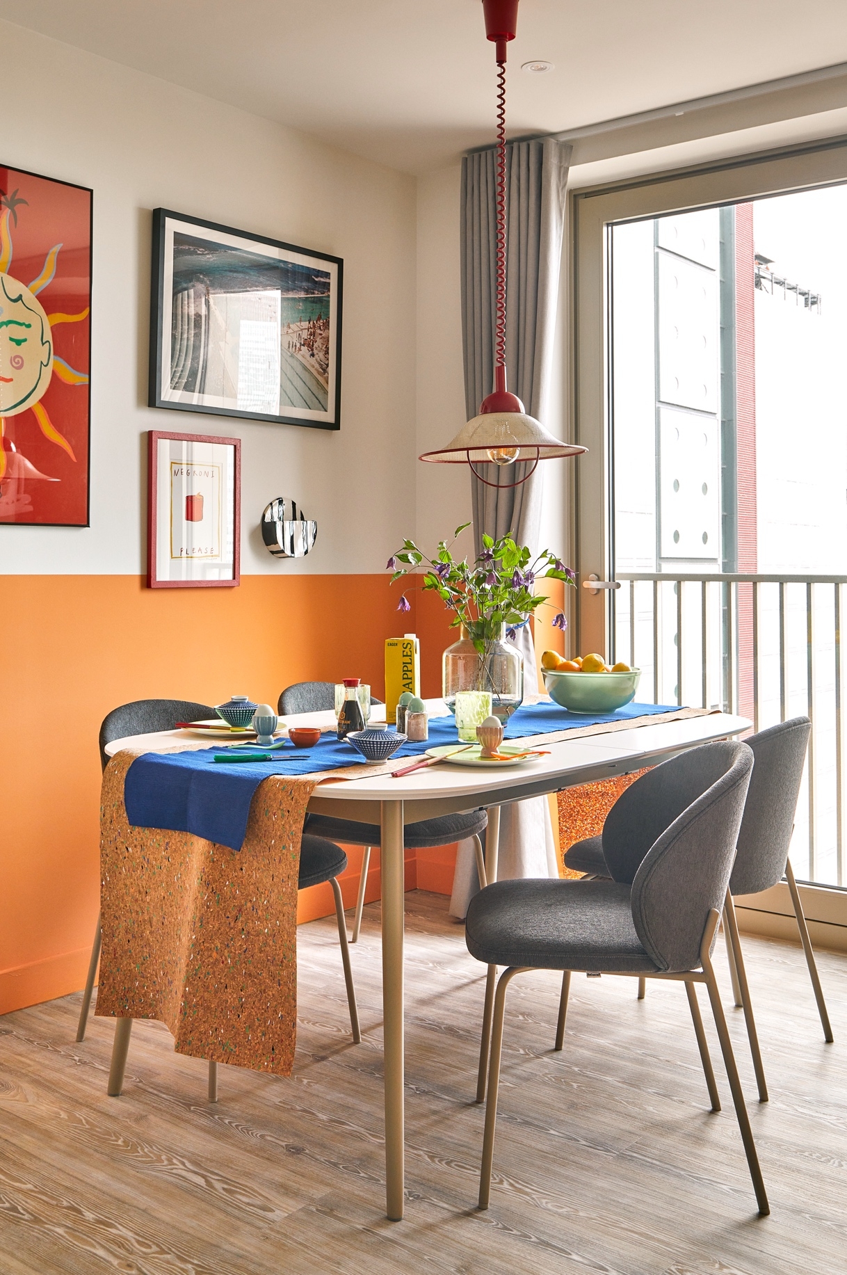 Design consultancy Holloway Li has added pop and colour to the classic toned-down kitchen and furniture. This kitchen styling is an example of how much can be done with a splash of paint and some eye-catching accessories 