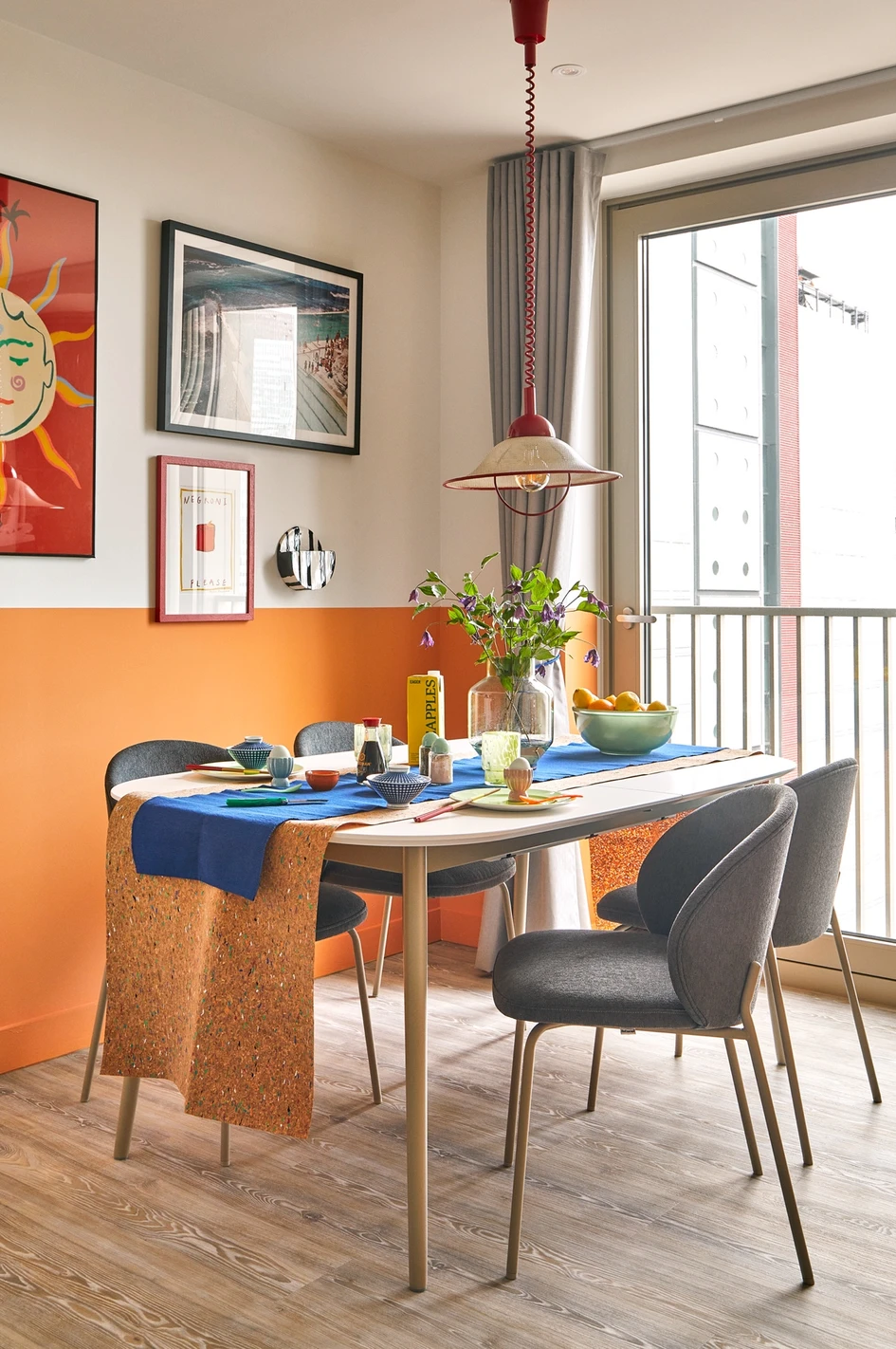 Design consultancy Holloway Li has added pop and colour to the classic toned-down kitchen and furniture. This kitchen styling is an example of how much can be done with a splash of paint and some eye-catching accessories 