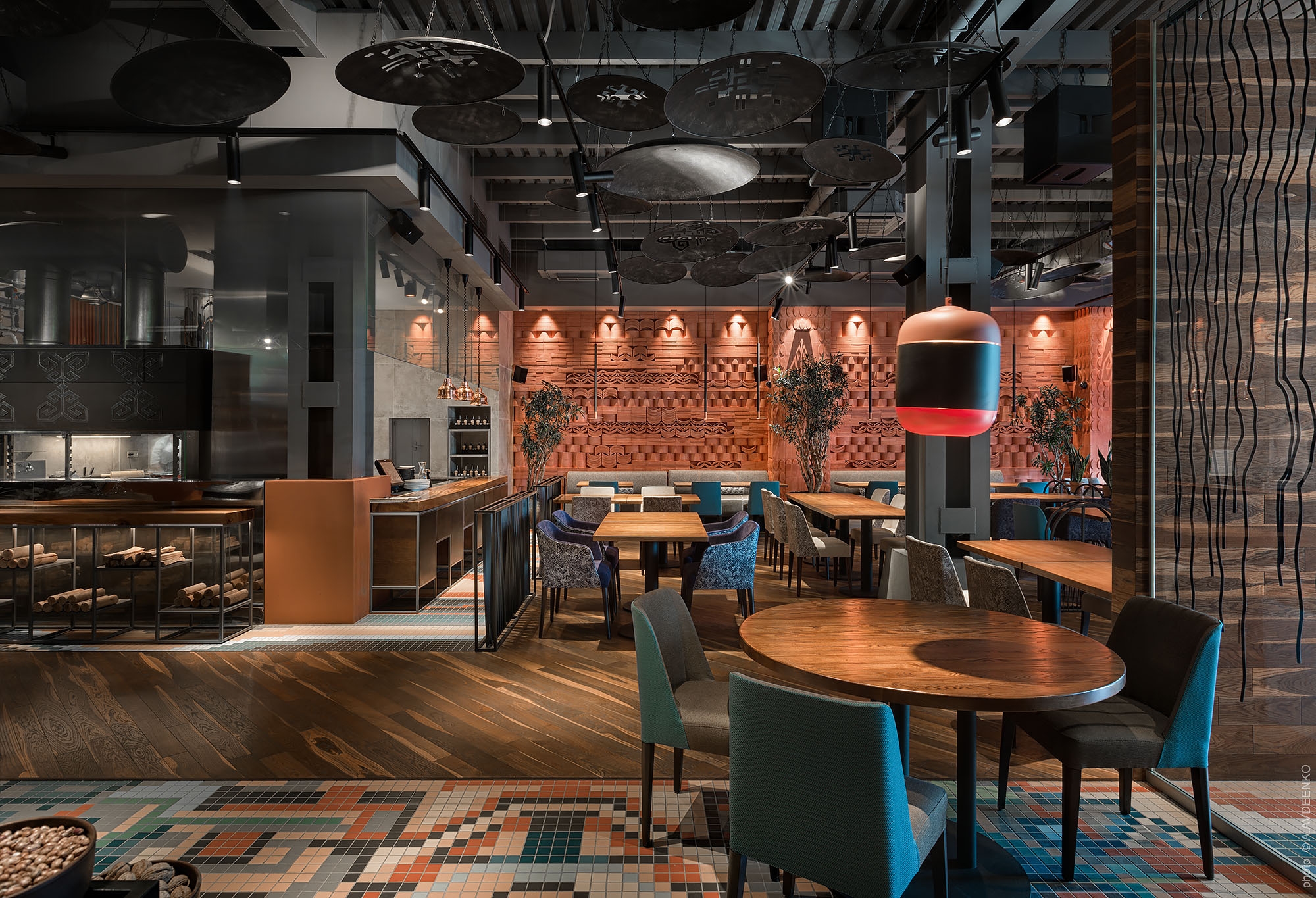 Traditional cooking processes combine with cultural decorative accents at the Ugli Restaurant, such as terracotta textures, mosaic tiling and suspended pilaf cauldrons. Photo: Andrey Adveenko