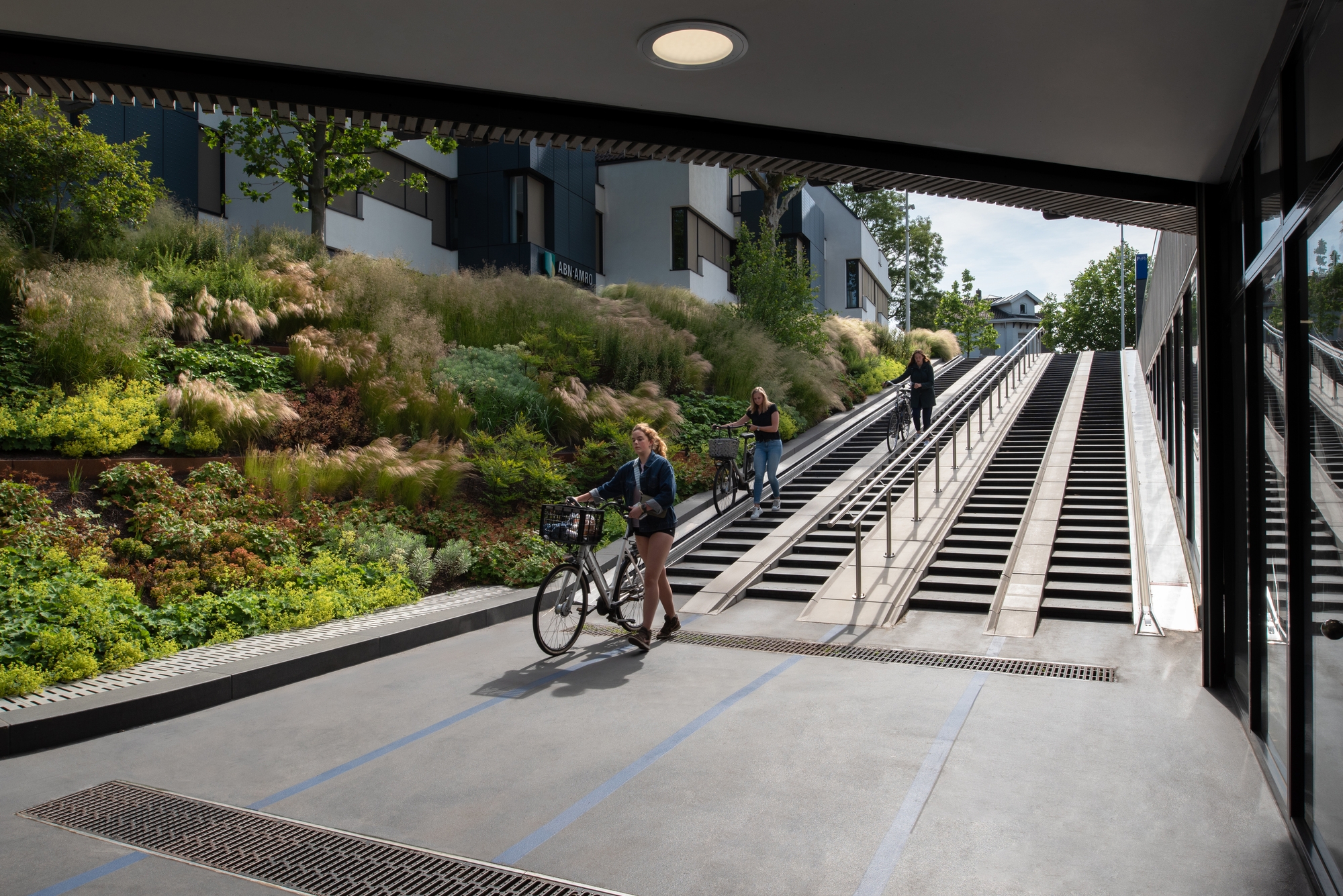 Cyclists in the Dutch city of Zwolle are ‘guided down the ramps of the station’s cycle park with plants that change with the seasons,’ explain architects Posadmaxwan. Photo: Aiste Rakauskaite