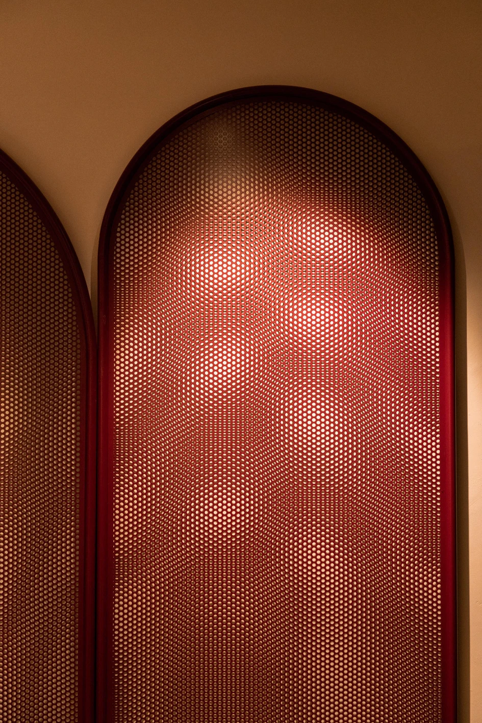 The Rock Shop (top) in Studio Gronda's Hard Rock Hotel Marbella contains clear ties to Andalusian architecture: carpet with local tile motifs, traditional Spanish grating in burgundy and contrasting golden arches over the blue walls. Photos: Jose Salto