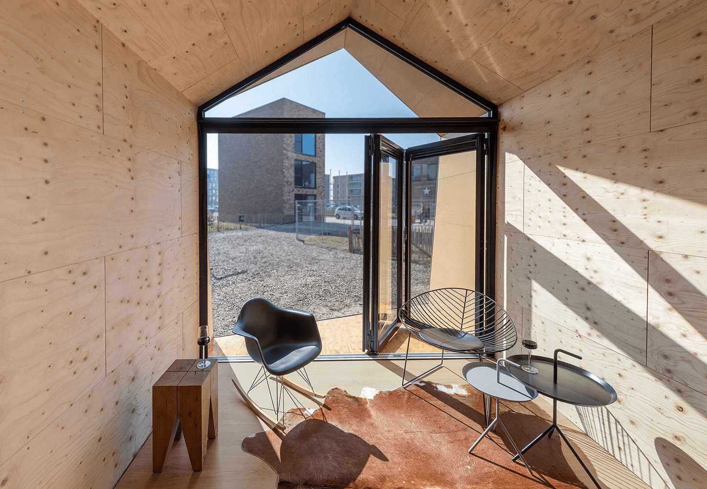 Trapezoid windows at the Hadaway House (top, middle) and Solarlux’s Ecoline bi-fold doors with triangular transom window above (bottom). Photos: James Dow / Patkau Architects (top, middle)