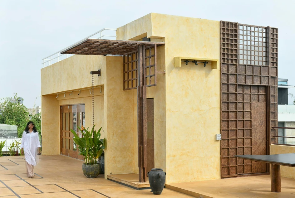 The bathroom at Dusk House achieves its fun-loving look and feel via a mix of raw materials, organic shapes and natural light. The crafted metal bathroom door (middle) is reminiscent of the woven design dialogue of the entrance. Photos: Monika Sathe