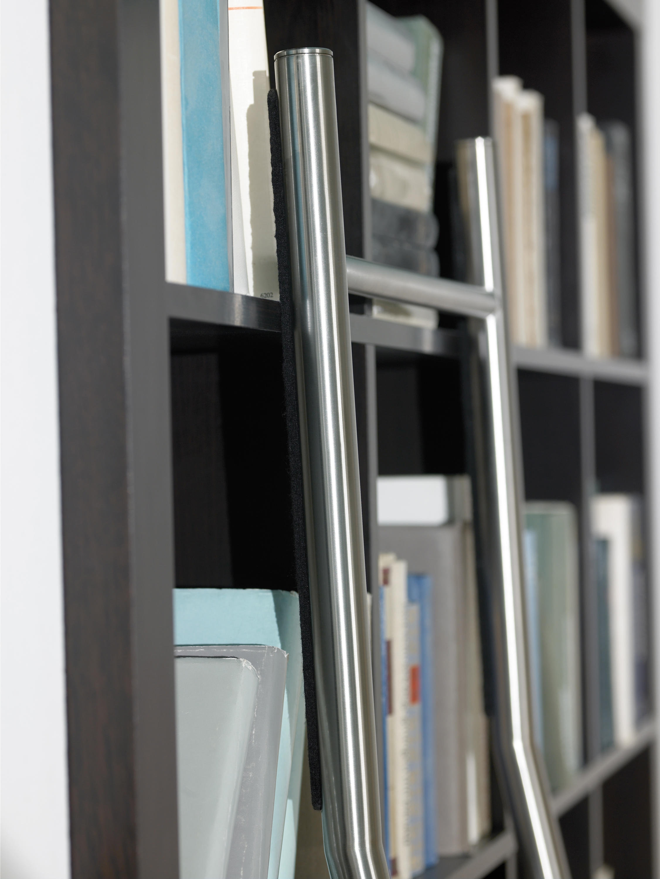 No track? No problem. Trackless ladder systems like MWE’s Positionable system sit securely on protective felt pads