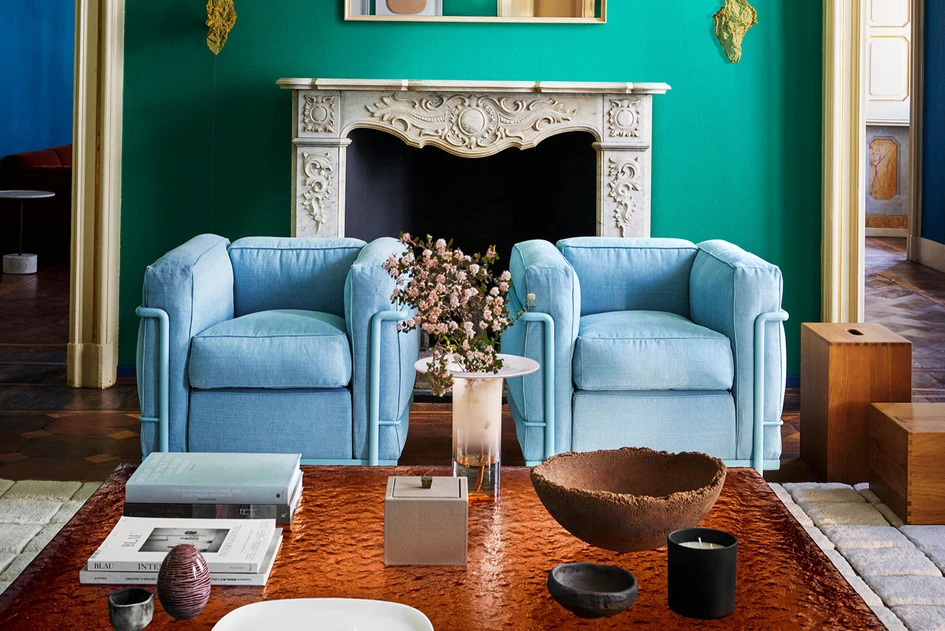 Thomas Lee’s original chair design with 9.5-inch armrests (top), Boss Design’s Luge Armchair (middle) with high, flat armrests and Le Corbusier’s iconic Grand Confort chair (bottom) for Cassina. Photo: Yale University Art Gallery (top)