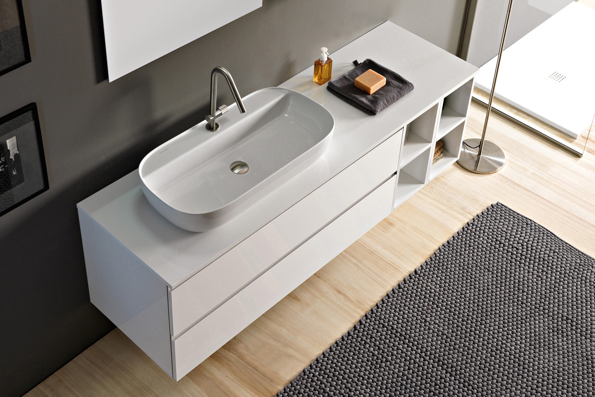 GB Group’s black aluminium framed Underground vanity unit (top, middle) and Scarabeo Ceramiche’s wall-hung Phorma shelving (bottom) both combine open and closed storage, keeping towels in easy reach and other items hidden