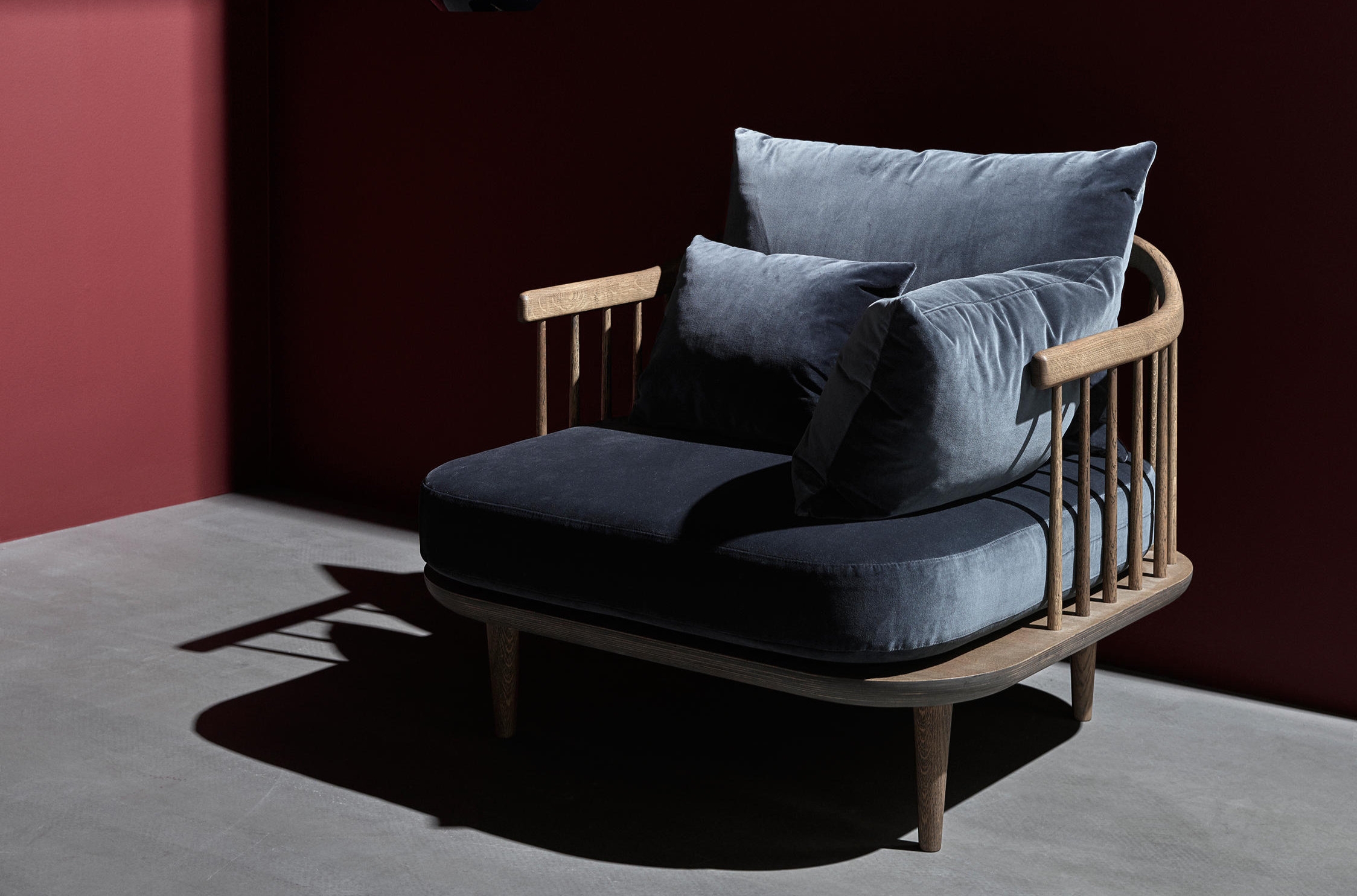 The natural warmth and texture of wood features heavily in many Scandinavian-designed pieces such as the legs of Ro™ from Fritz Hansen (top) and the frame of Fly from &Tradition (bottom)