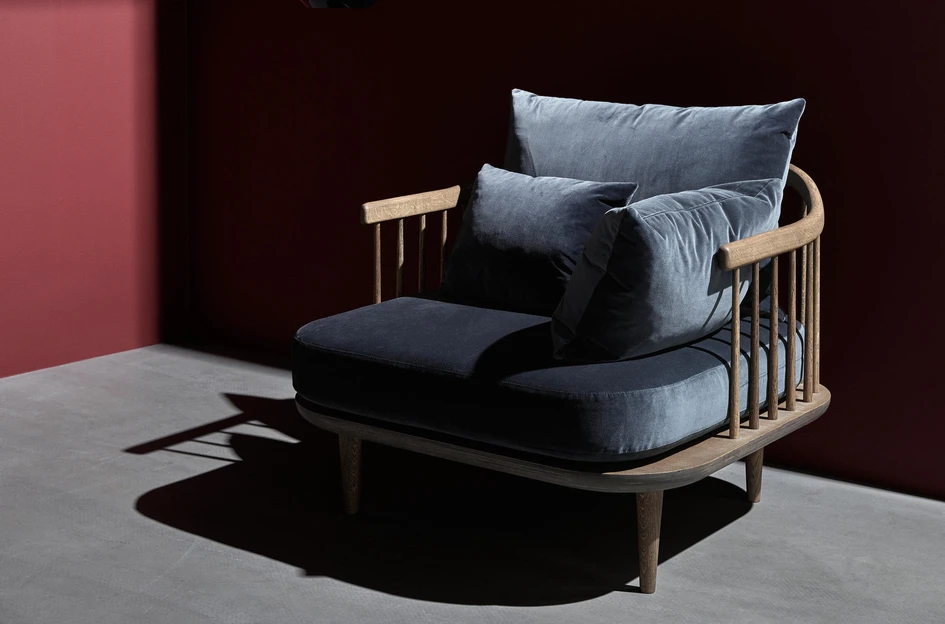 The natural warmth and texture of wood features heavily in many Scandinavian-designed pieces such as the legs of Ro™ from Fritz Hansen (top) and the frame of Fly from &Tradition (bottom)