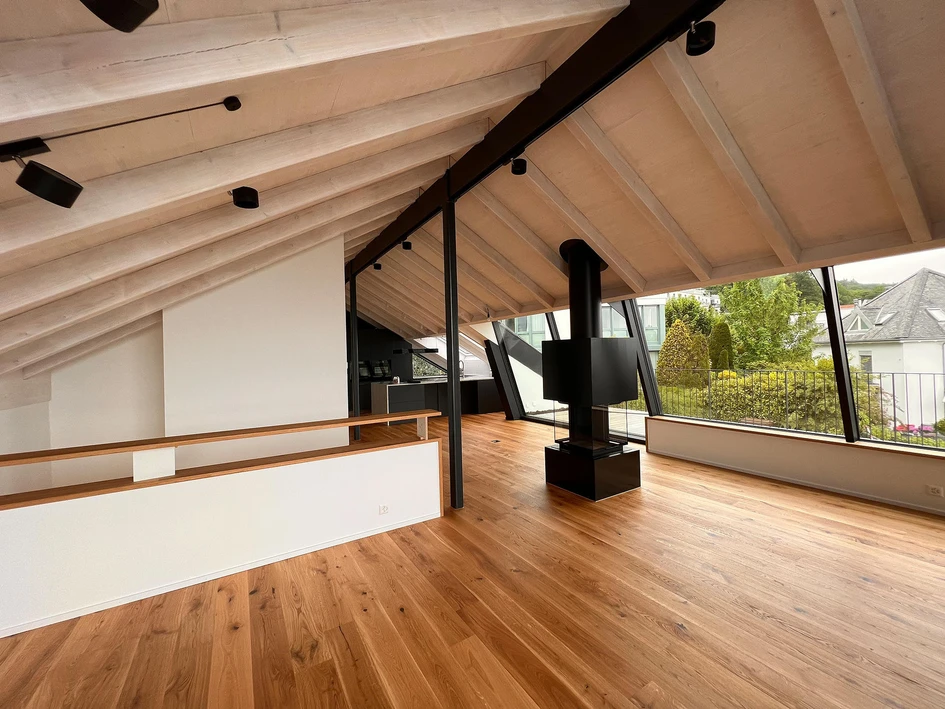 The top floor of this house on Lake Zurich features sliding windows that open out onto a viewing terrace, which are also slanted to receive more light and better views of the surrounding landscape. Photos: Air-Lux