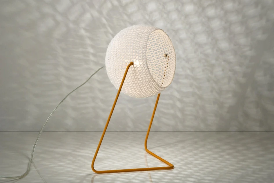 The tight weave of the Aurizia lamp’s curved petals (top, middle) filter out its light, whilst the loose weave of the Trama lamp’s shade (bottom) projects its pattern onto nearby surfaces