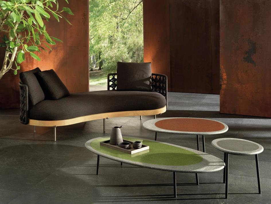 Minotti offers calming, natural fabrics and materials for outdoors – see the Sendai Cord Outdoor armchair (above) and the Torii Nest Outdoor angled open sofa with Isole coffee tables (below)