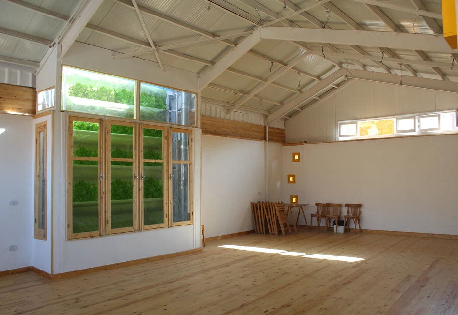 The vibrant yellow hue in the facade of Dawar El Ezba Cultural Center optimises sunlight reflection, illuminating the interior given the narrowness of its urban setting. Photos: Ahmed Hossam Saafan