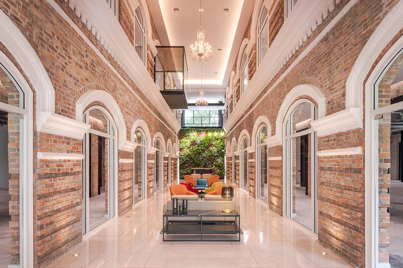 Sentul Works' double-volume atrium establishes a visual connection without compromising privacy. Photo: David Yeow