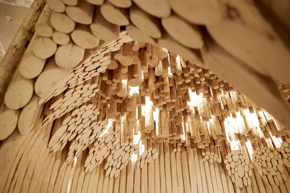The pavilion expresses the warmth and conviviality of kitchens, sparking a conversation between architecture and design