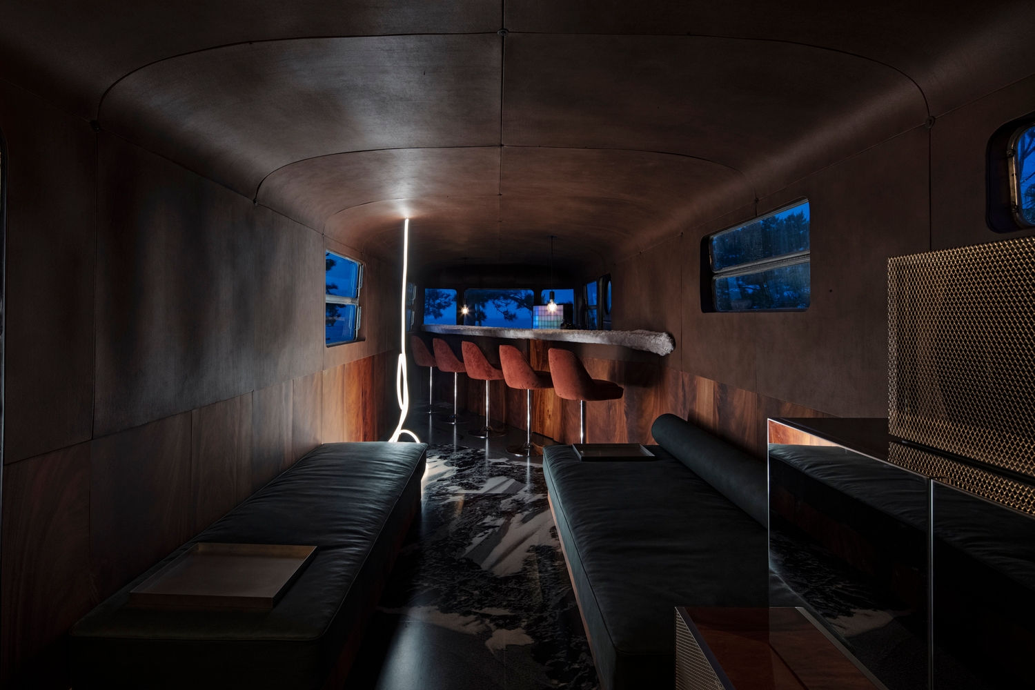 In Japan, DDAA's NOT A HOTEL ANYWHERE creates distinct living spaces using five vehicles, each equipped with only one function, such as a bedroom or study car. Photos: Kenta Hasegawa