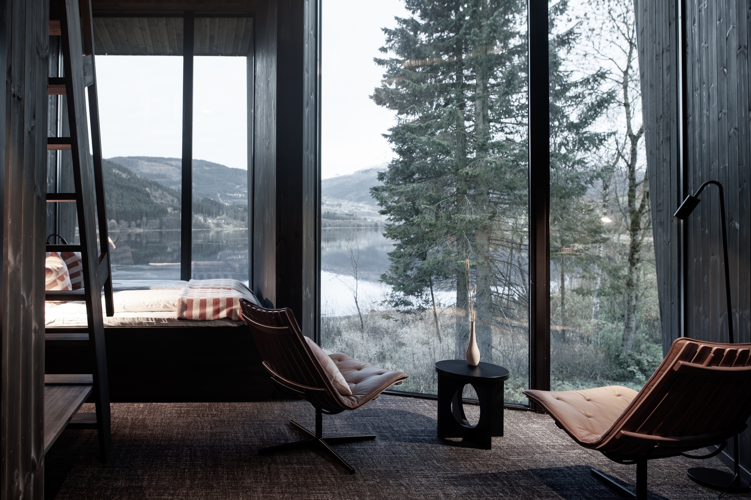 The raised buildings of Mange Bekker Arkitektur's Elva Hotel create a variety of covered outdoor spaces for the guests and allow visual transparency through the buildings toward the waterfront. Photos: Sam Hughes