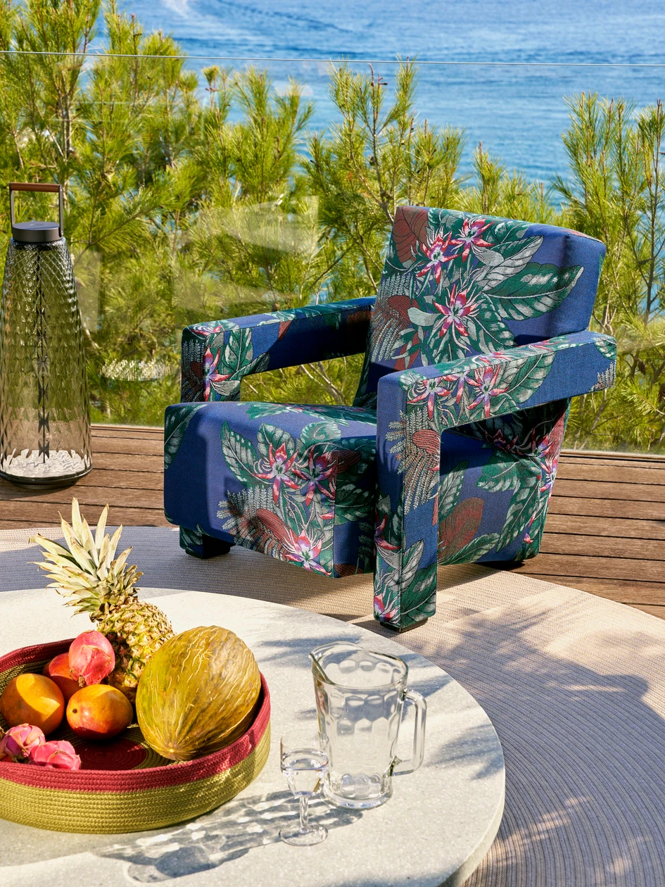 Here the armchair sports the floral Favignana fabric, crafted through a jacquard process. Photo: Francesco Dolfo