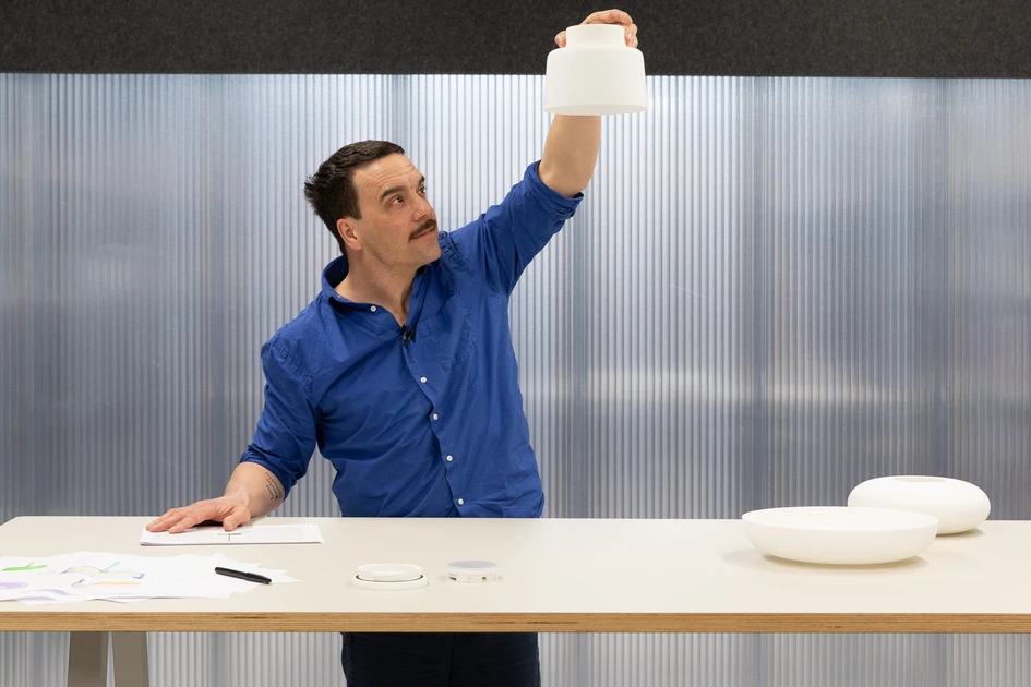 Each lamp is made up of two constituent parts: a central pendant module in powder-coated zinc alloy; and one of three opaque glass shades