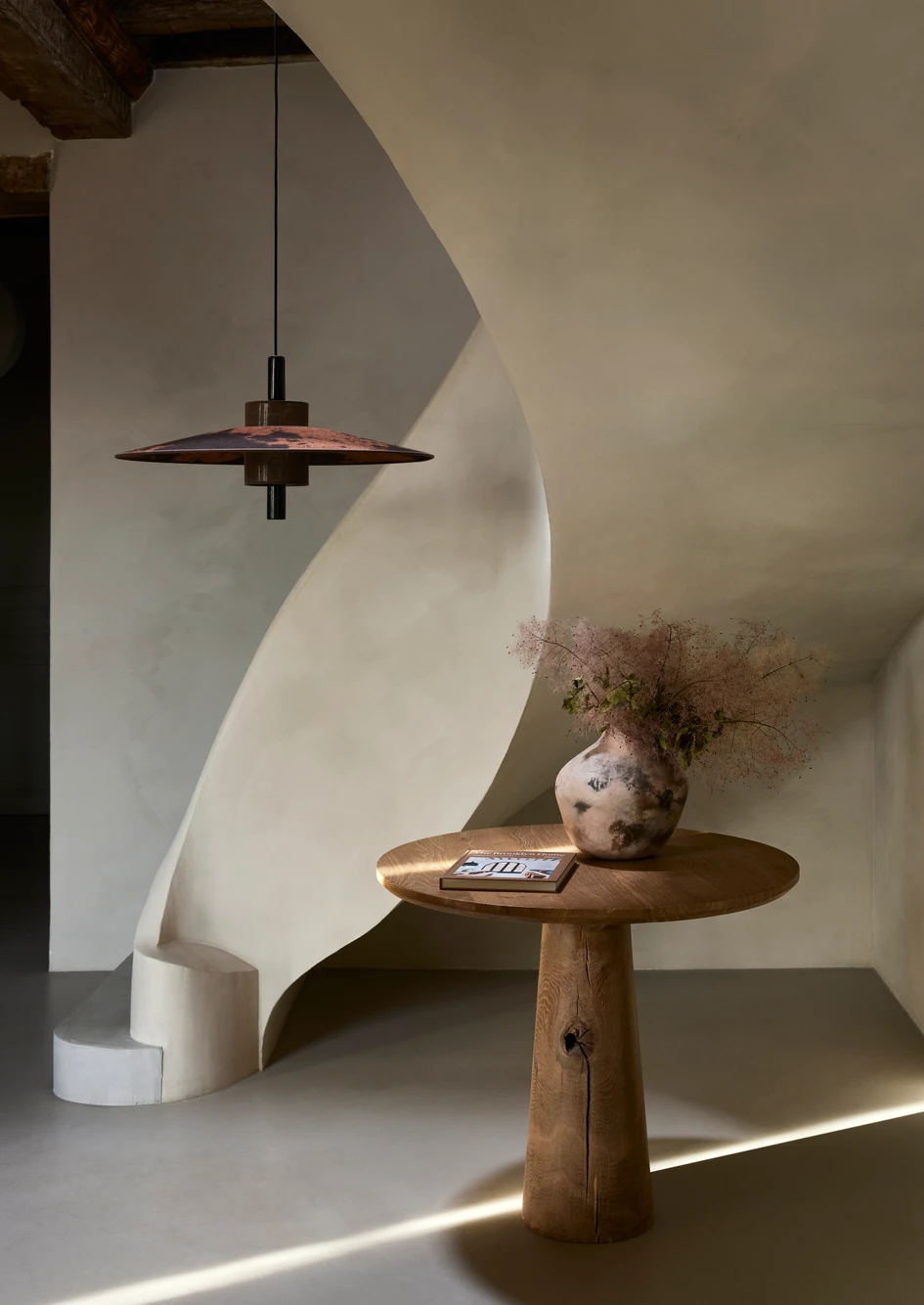 The designer turned to Kasia Woznica-Raulin, a specialist in vegetable dyeing, to give every lampshade a one-of-a-kind character. Pictured here, Thésée in Graphite (above) and Terracotta (below)