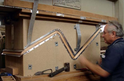 The high frequency press for the molding of the chair plywood in action (all wood parts were produced by Kazakis A.E., Greece)