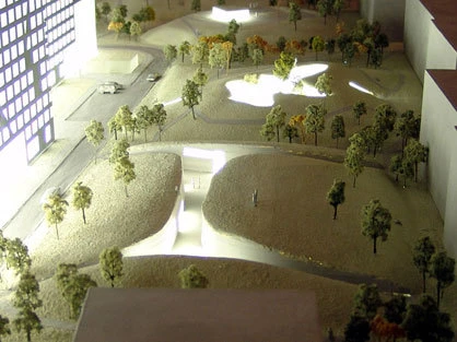 The earth excavated during the construction of the project has been landscaped to create a series of mounds housing public recreational areas.