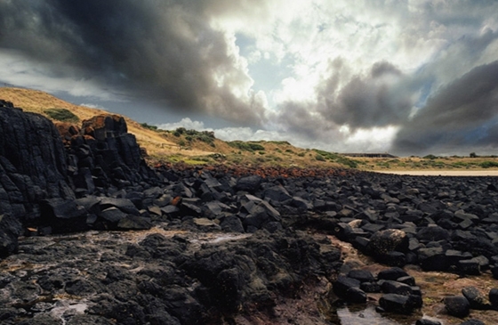 Black rocks at the coast, photo © Denton Corker Marshall