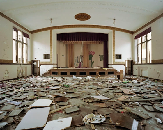 The auditorium at Jane Cooper Elementary School, which has been stripped of almost all its metal, leaving only the wooden seats and backs; photo Sean Hemmerle