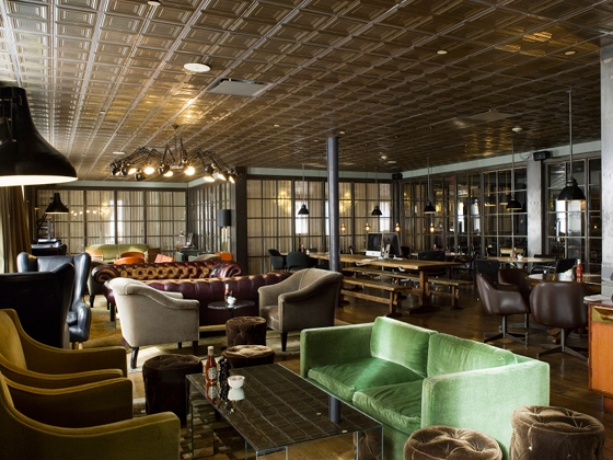 The antithesis of the traditional office: Soho House New York's Drawing Room is designed for digital nomads to set up temporary work camp in style. Cocktails aid work efficiency.