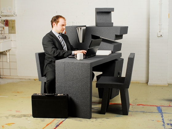 Tim Vinke's 'Het Kruikantoor' mobile office concept. Made of lightweight foam, the portable unit consists of two chairs, a desk, a light and storage that slot together, puzzle-like, to form a moveable trolley