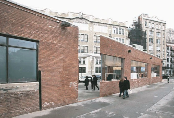 Break in the facade of Yamamoto Street Store which exposed new views of the structure behind the building