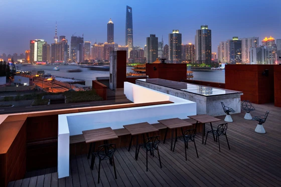 Building upwards has the obvious advantage of offering improved views; in this case, of the Pudong skyline from the new roof terrace; architecture: NHDRO, photo: Derryck Menere