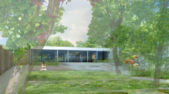 Maggieʼs Monklands by Reiach and Hall Architects features a walled garden leading to a reflecting pool at the end of the lawn; image courtesy Reiach and Hall Architects