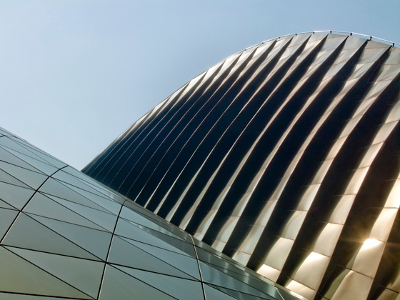 Glazed vertical strips on the northern elevation allow light to penetrate the façade; photo Nigel Young