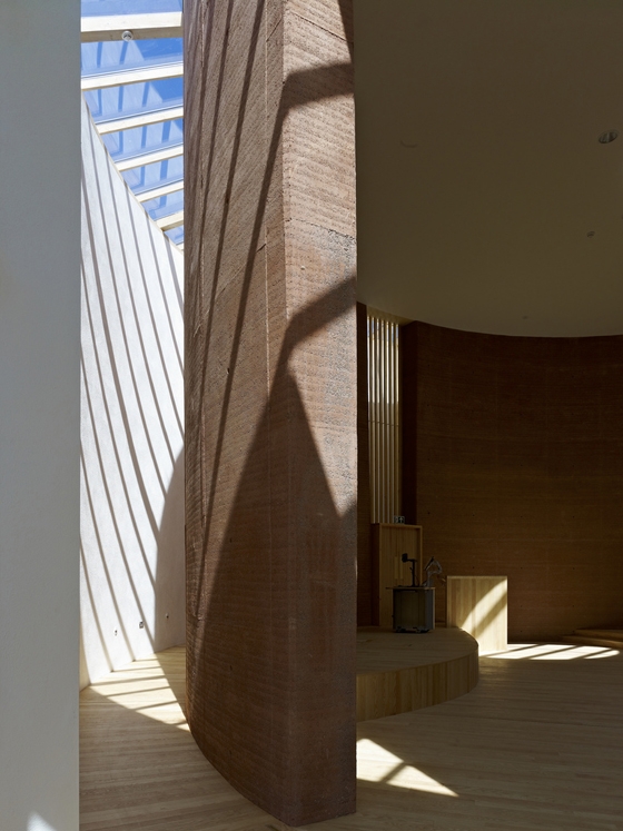 Rammed-earth walls support the roof of this lecture theatre at the Wales Institute for Sustainable Education; photo Timothy Soar