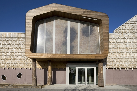 Guinée + Potin Architects used wooden shingles typical of the area to weatherproof the exterior of this museum extension in France; photo Stéphane Chalmeau