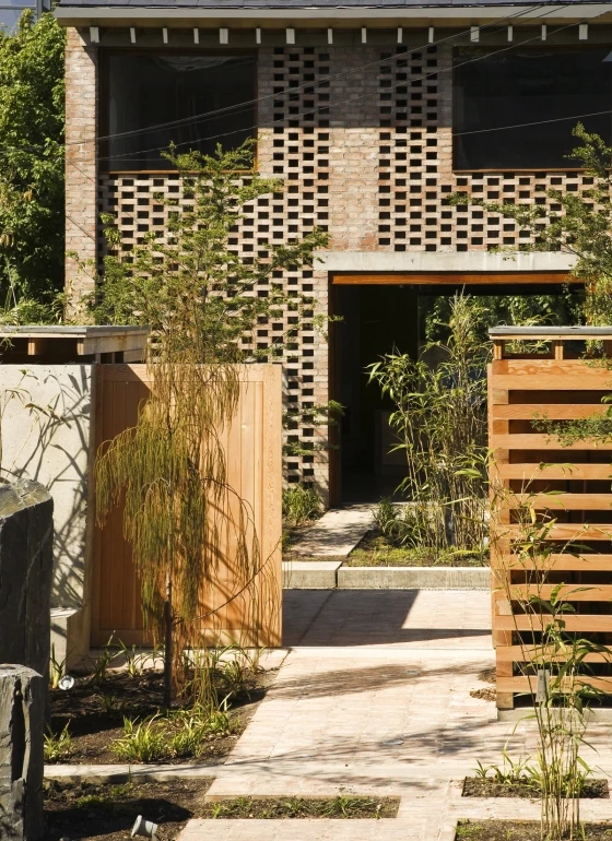 On the opposite side of the house, the corresponding bricks have been removed, leaving holes for ventilation; photo: Alice Clancy