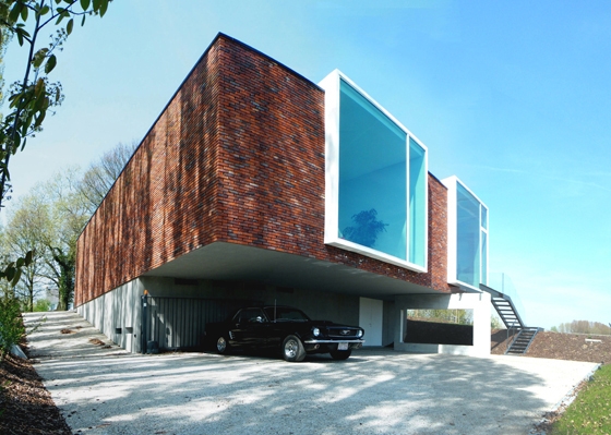 The monotone brick helped the architects achieve the neutral aesthetic they thought suitable for the building’s purpose and location; photo: Atelier Vens Vanbelle