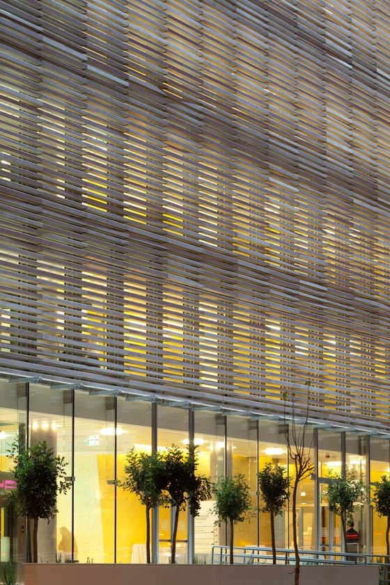 Downtown-Athens' Onassis Cultural Centre uses linear pieces of Thassos marble to construct its façade, which, depending on how close or far away you are from it, appears opaque or semi-transparent; photos © Nikos Daniilidis