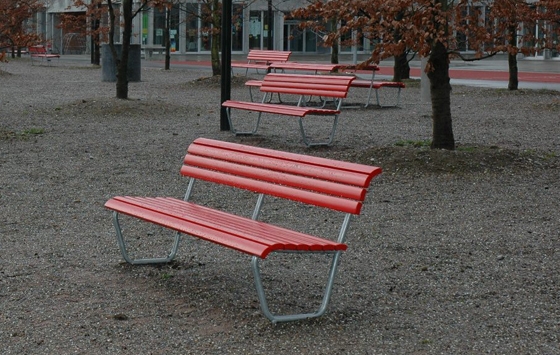 The classical red Landi bench, designed by Alfred Altherr & Charles Hoch 1939