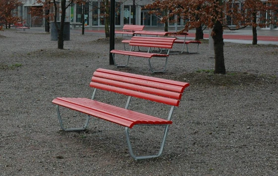 The classical red Landi bench, designed by Alfred Altherr & Charles Hoch 1939
