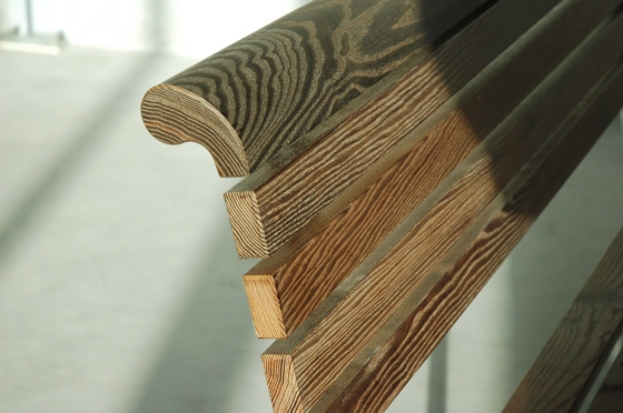 Detail of a Landi bench materialised in Natwood