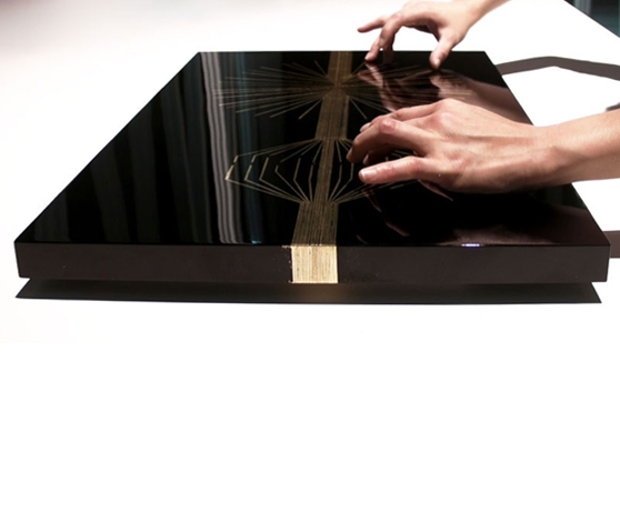 'Urushi musical interface', by Yuri Suzuki, a touch panel style instrument which uses the principle of gold inlay