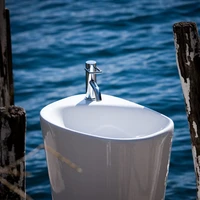 <b>The one and only</b>: The monolithic 'Menhir' free-standing wash basin marries, like the rest of the collection, organic curves with a healthy dose of the rational