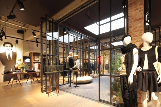 Dusseldorf-based office Reich und Wamser’s design for the Esprit Lighthouse store in Cologne makes visitors conscious of the space as they move through its differentiated areas; at its heart is a the winter garden, shown here