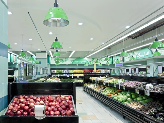 Colour-coded, contemporary metal pendant lights punctuate the space throughout the Lulu Hypermarket in Abu Dhabi, designed by the Emke Group with light planning by Ansorg. Green for fresh produce, blue for fish, red for the meat section and so on