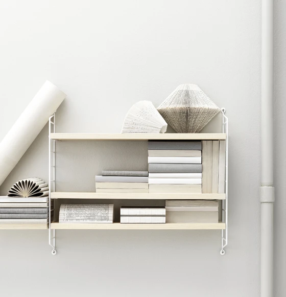 The 2013 edition of imm cologne saw <b>String</b>, the Swedish manufacturer of the eponymous shelving system, extend its ‘String Pocket’ lightweight shelving, offering the product in three new designs: copper, raw and ash/white
